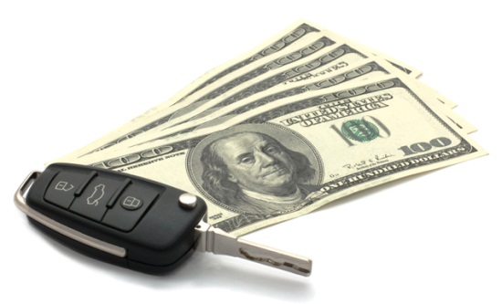 Car Key and Dollars isolated on white.